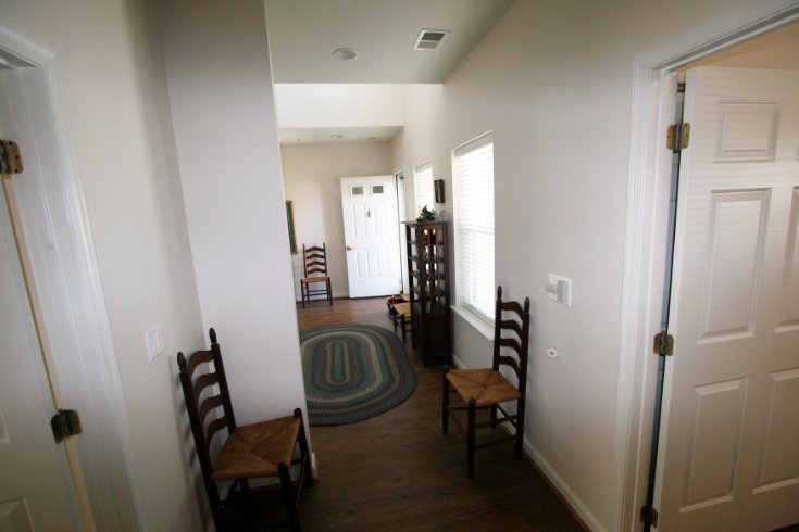 Hallway between bedroom wing and front door